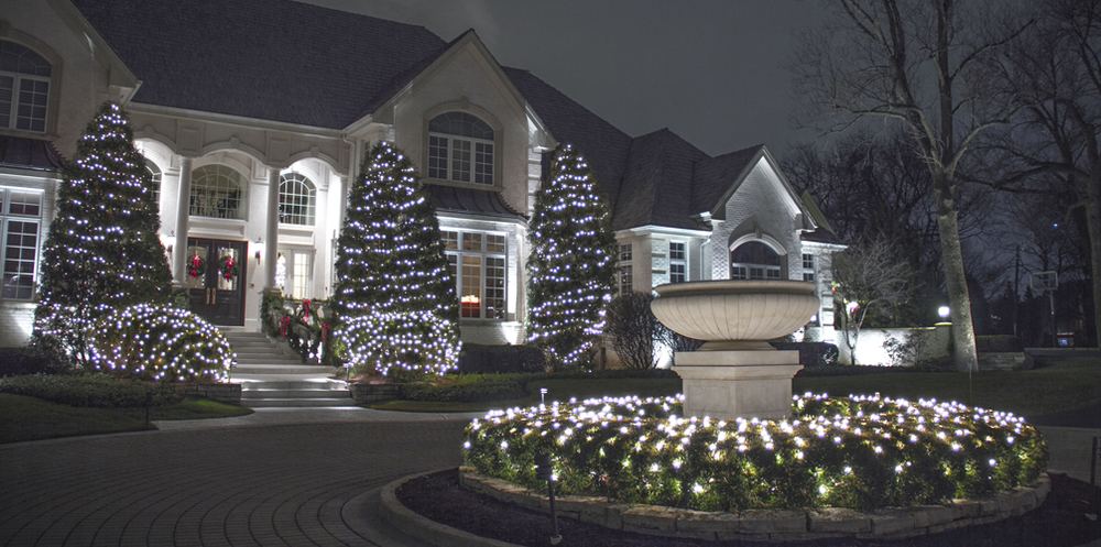 Home with landscape and fountain lighting